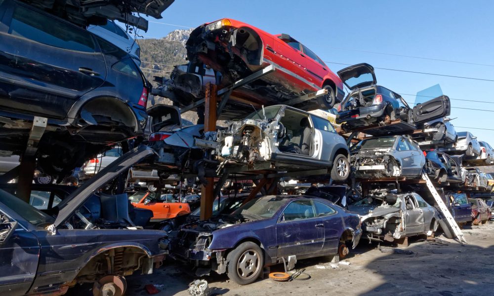 Valais, Switzerland, 21.02.2019, Recycling of old,used, wrecked cars. Dismantling for parts at scrap yards and sending for remelting