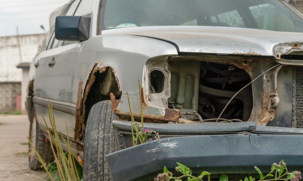 Scrap car being towed away for recycling in Oshawa by RN Scrap Junk Cars